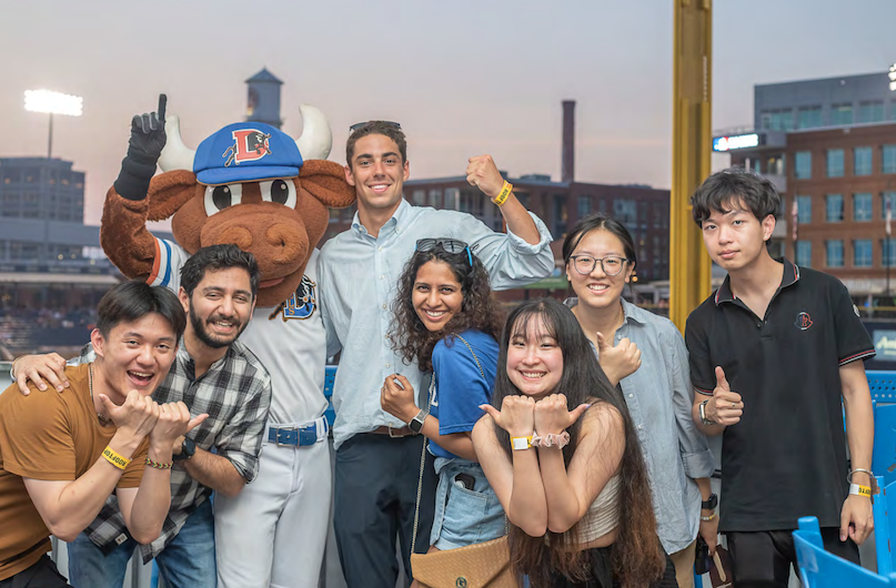 FlexGen employees and interns at a baseball game